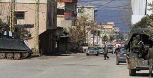 جرحى في مداهمات حي الشراونة